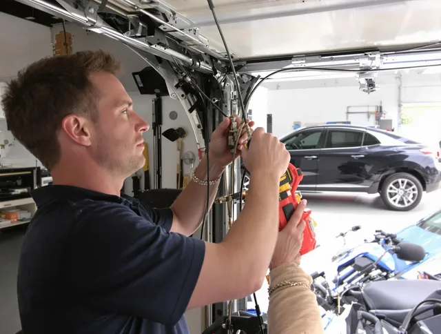 Rockland Garage Door Repair safety certified technician performing cable replacement in Rockland