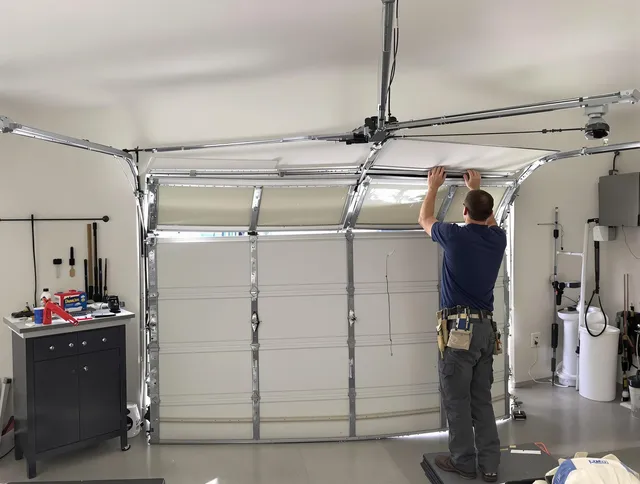 Rockland Garage Door Repair specialist performing precise section replacement on Rockland garage door