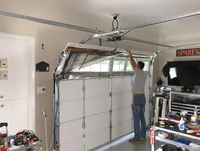 Garage door section replacement by Rockland Garage Door Repair in Rockland